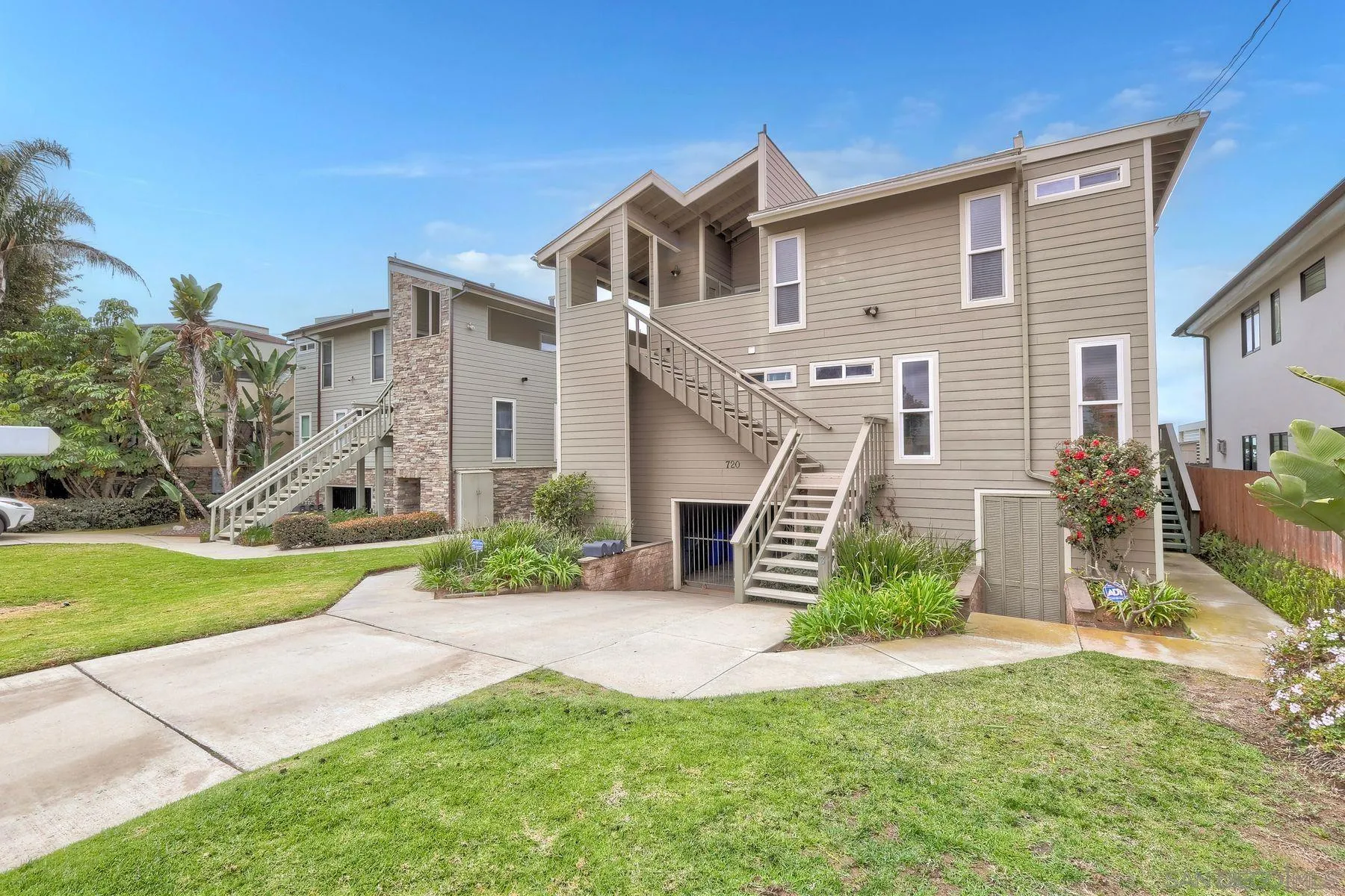 720 4th Street, Unit 1 Encinitas, CA 92024 - Photo 13 of 29 a front view of a house with garden