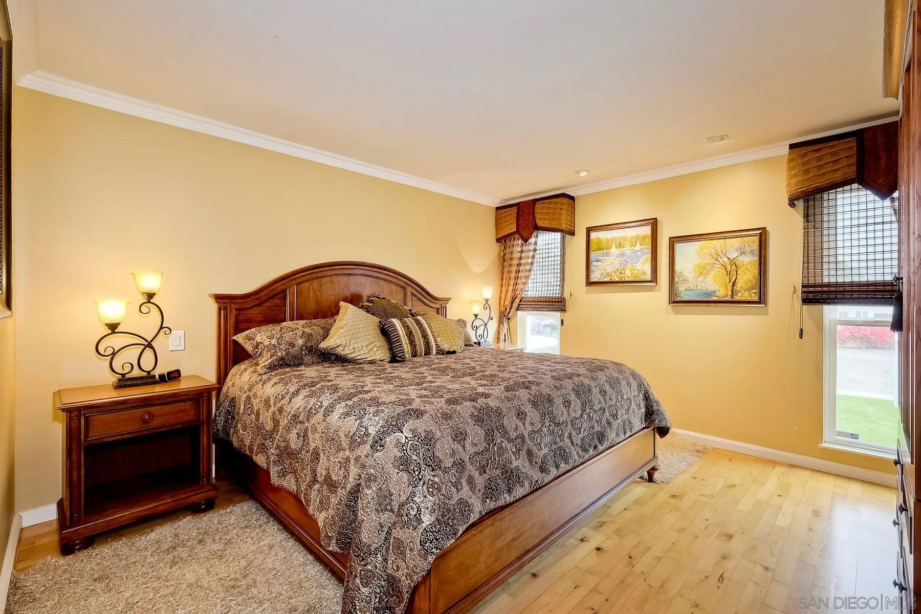 720 4th Street, Unit 1 Encinitas, CA 92024 - Photo 17 of 29 a bedroom with a bed and a painting on the wall