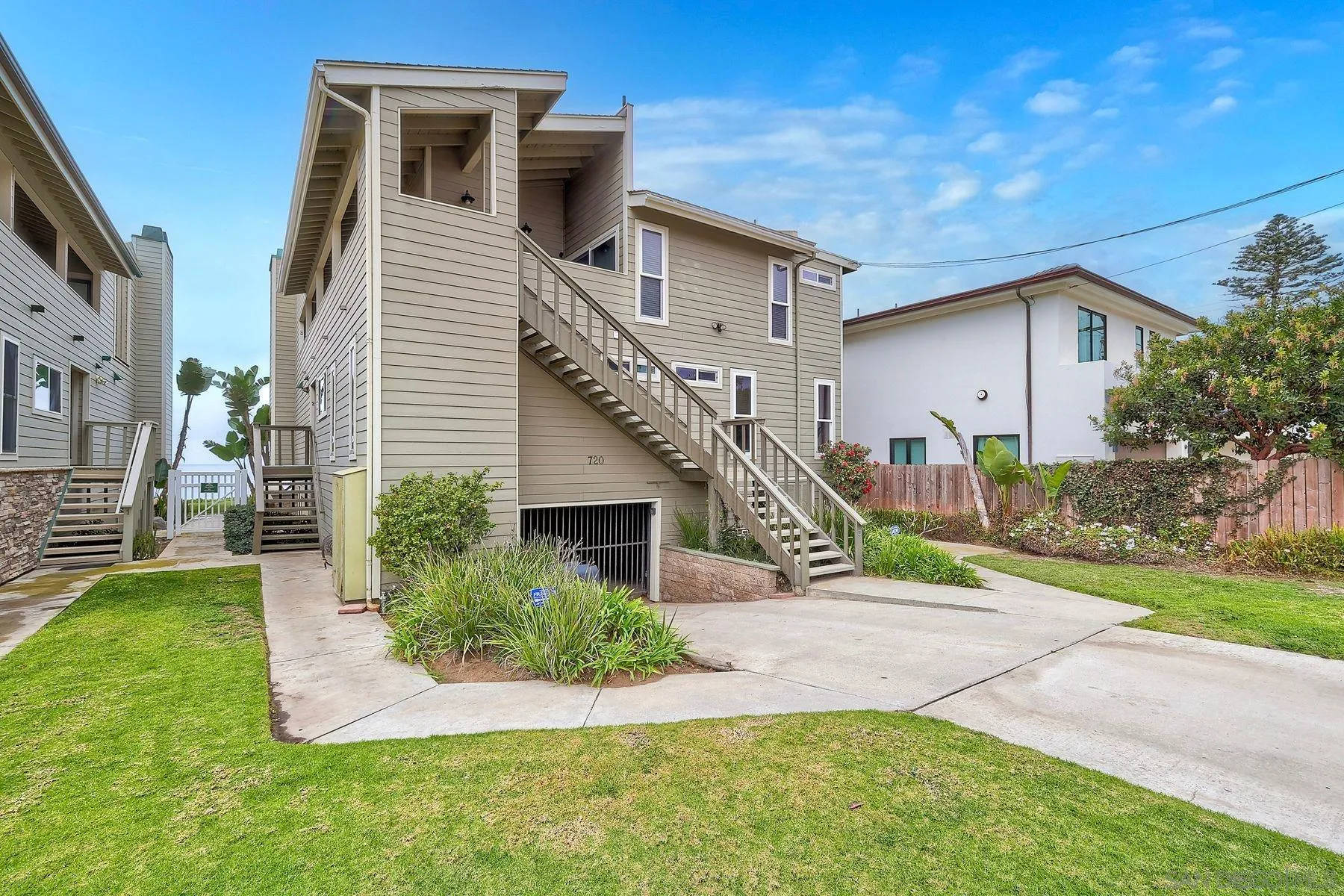 720 4th Street, Unit 1 Encinitas, CA 92024 - Photo 18 of 29 a view of a house with a yard and stairs