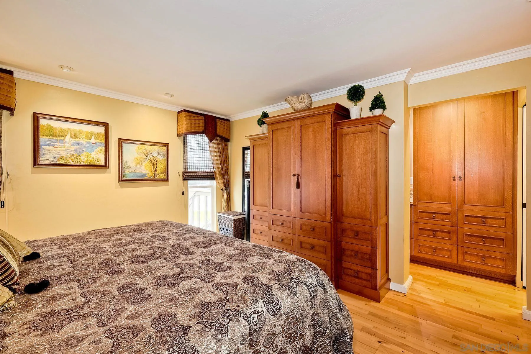 720 4th Street, Unit 1 Encinitas, CA 92024 - Photo 21 of 29 a bedroom with a bed and a mirror