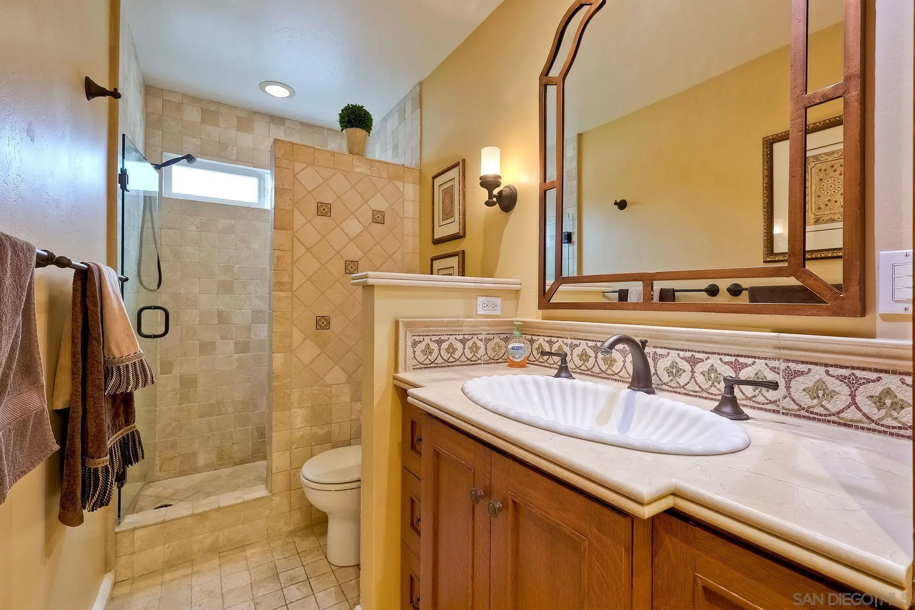 720 4th Street, Unit 1 Encinitas, CA 92024 - Photo 22 of 29 a bathroom with a sink a toilet and shower