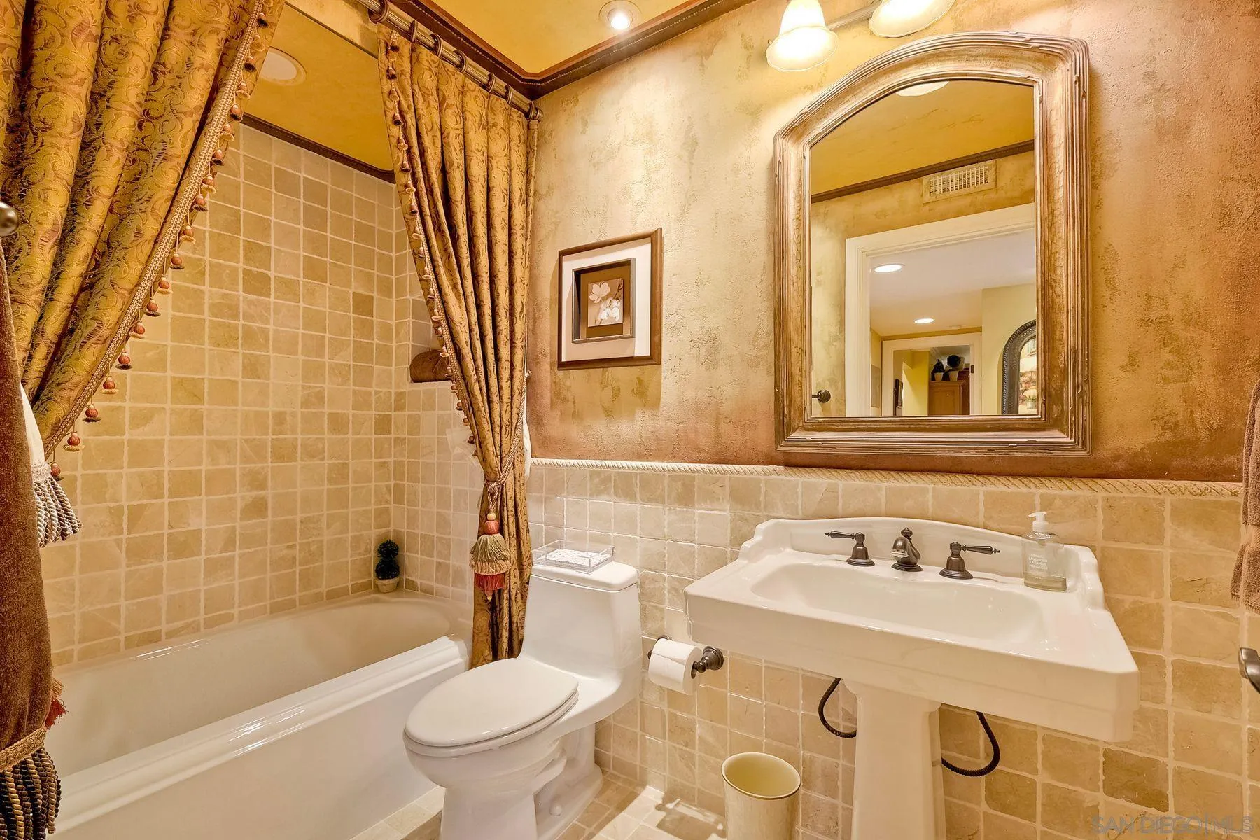 720 4th Street, Unit 1 Encinitas, CA 92024 - Photo 25 of 29 a bathroom with a sink a toilet and shower