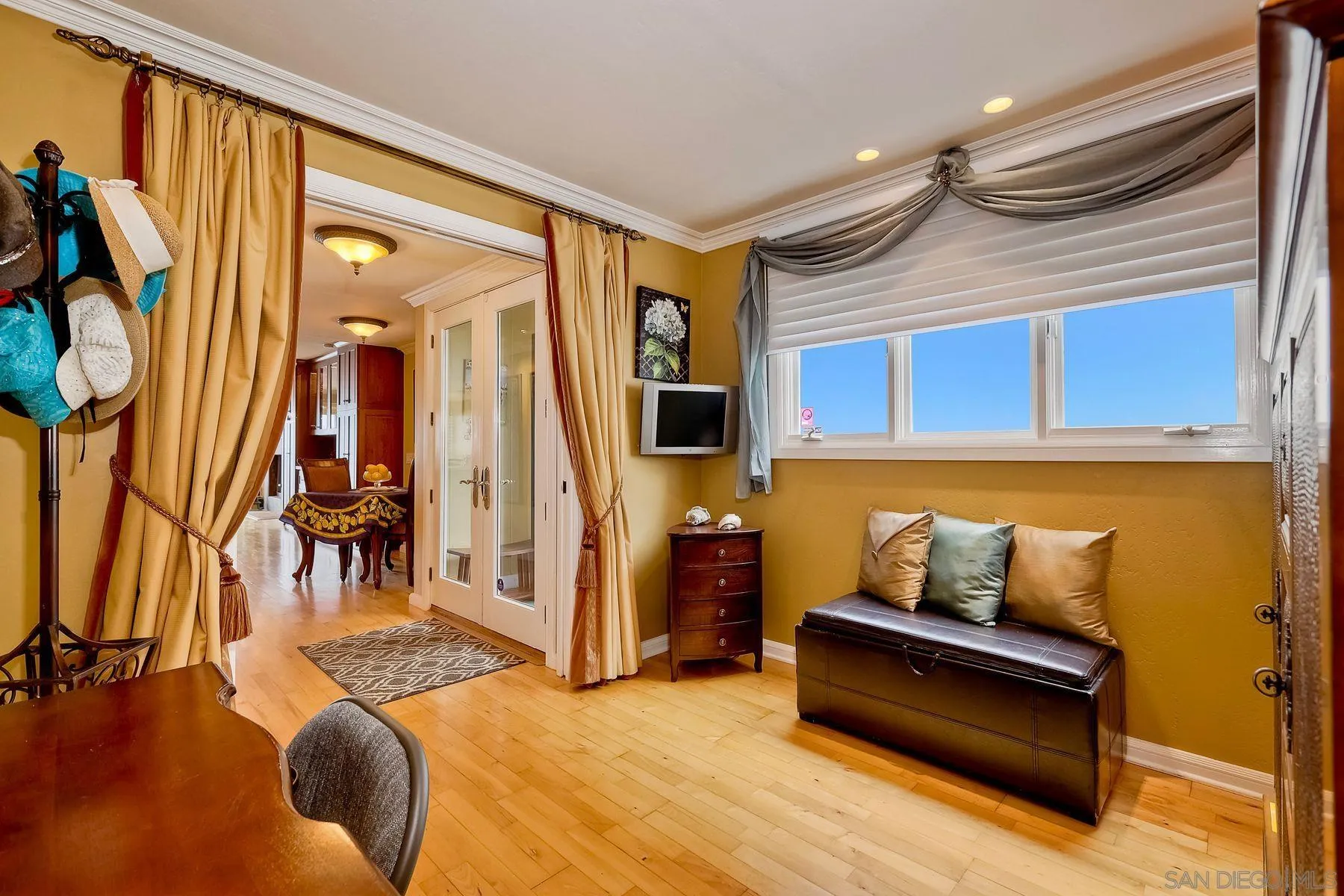 720 4th Street, Unit 1 Encinitas, CA 92024 - Photo 26 of 29 a bedroom with furniture and a window