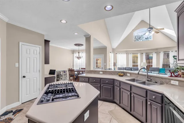 a view of a dining room with furniture and chandelier