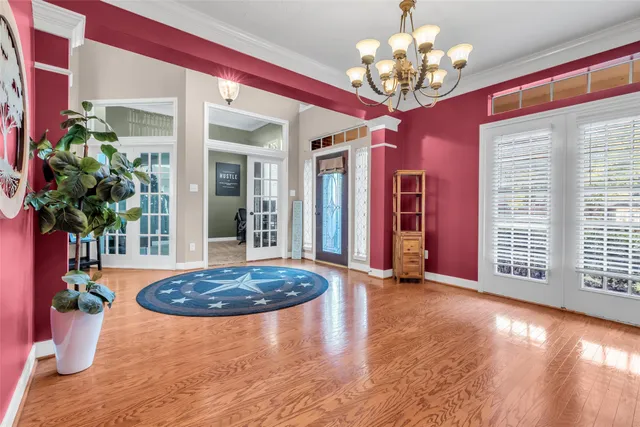 a view of a living room and chandelier