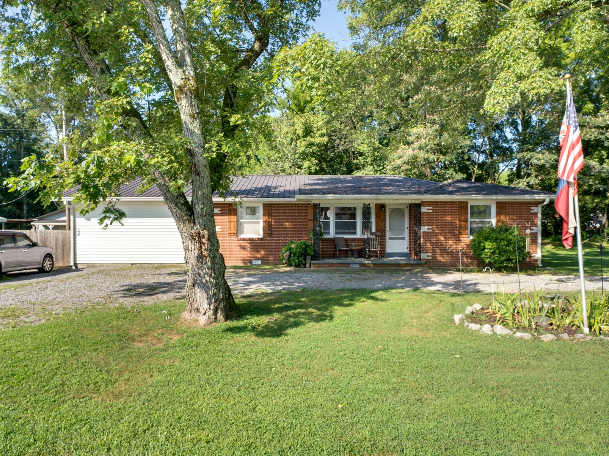 125 The Trace Dover, TN 37058 - Photo 1 of 29 a view of a house with backyard and a tree