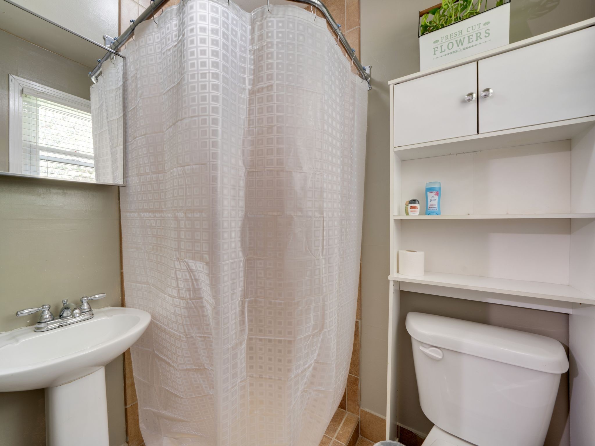 125 The Trace Dover, TN 37058 - Photo 15 of 29 a bathroom with a sink a toilet and a mirror