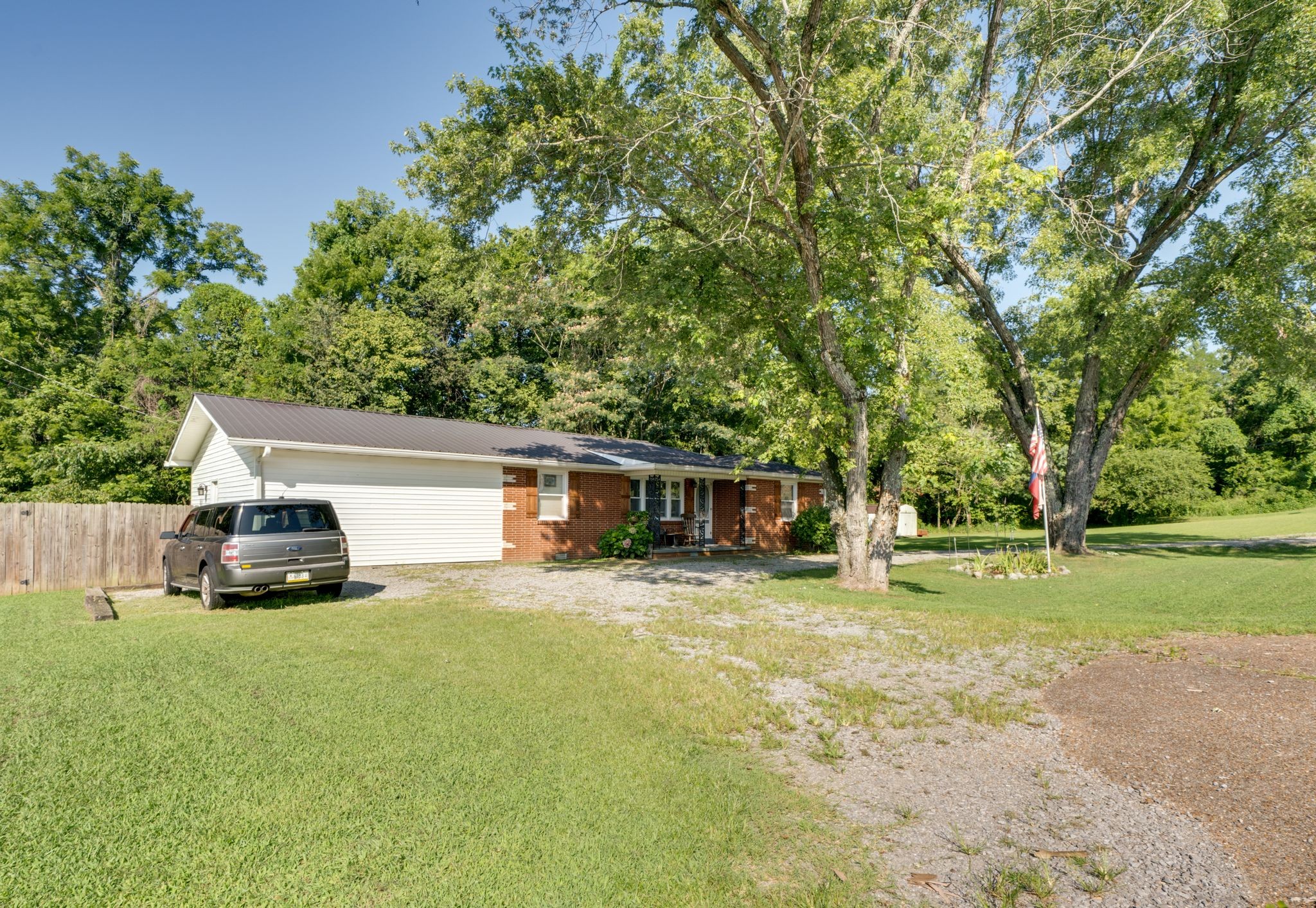 125 The Trace Dover, TN 37058 - Photo 2 of 29 a view of a house with backyard and trees