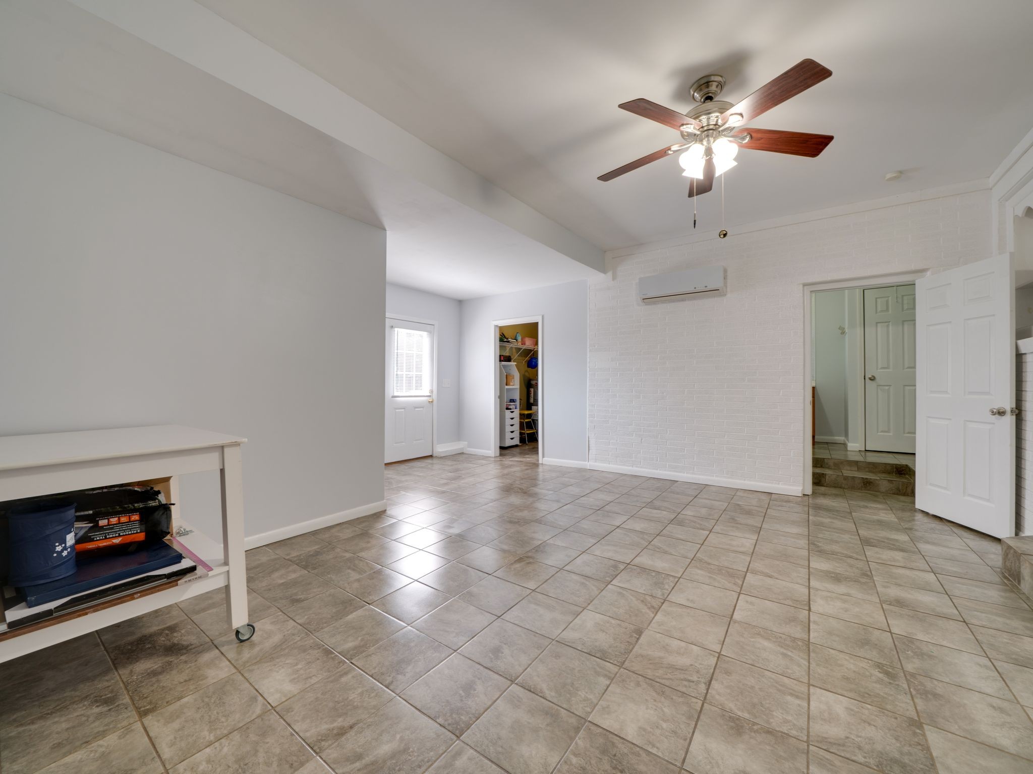 125 The Trace Dover, TN 37058 - Photo 22 of 29 a view of an empty room with chandelier fan and fire place