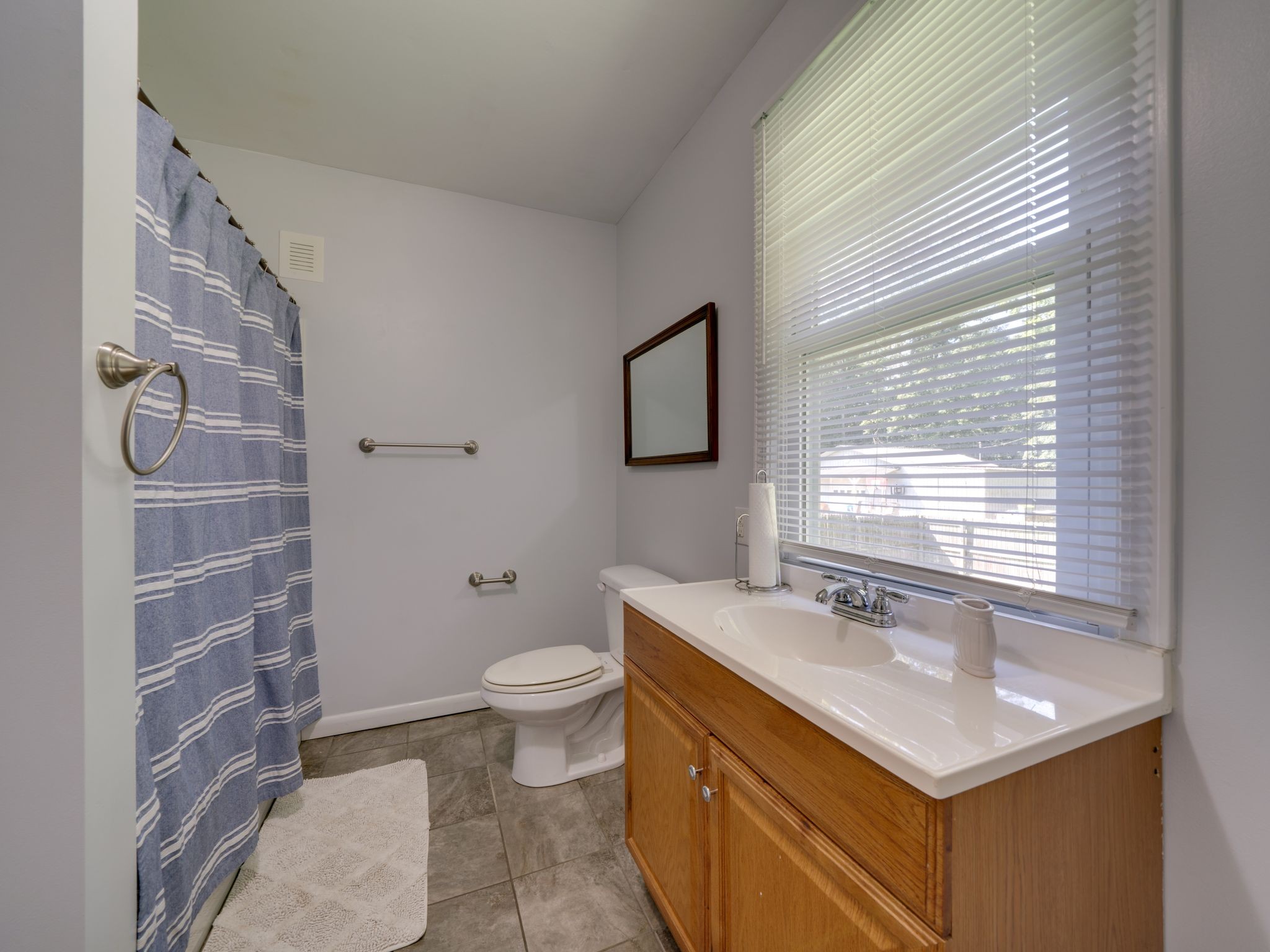 125 The Trace Dover, TN 37058 - Photo 23 of 29 a bathroom with a sink toilet and mirror