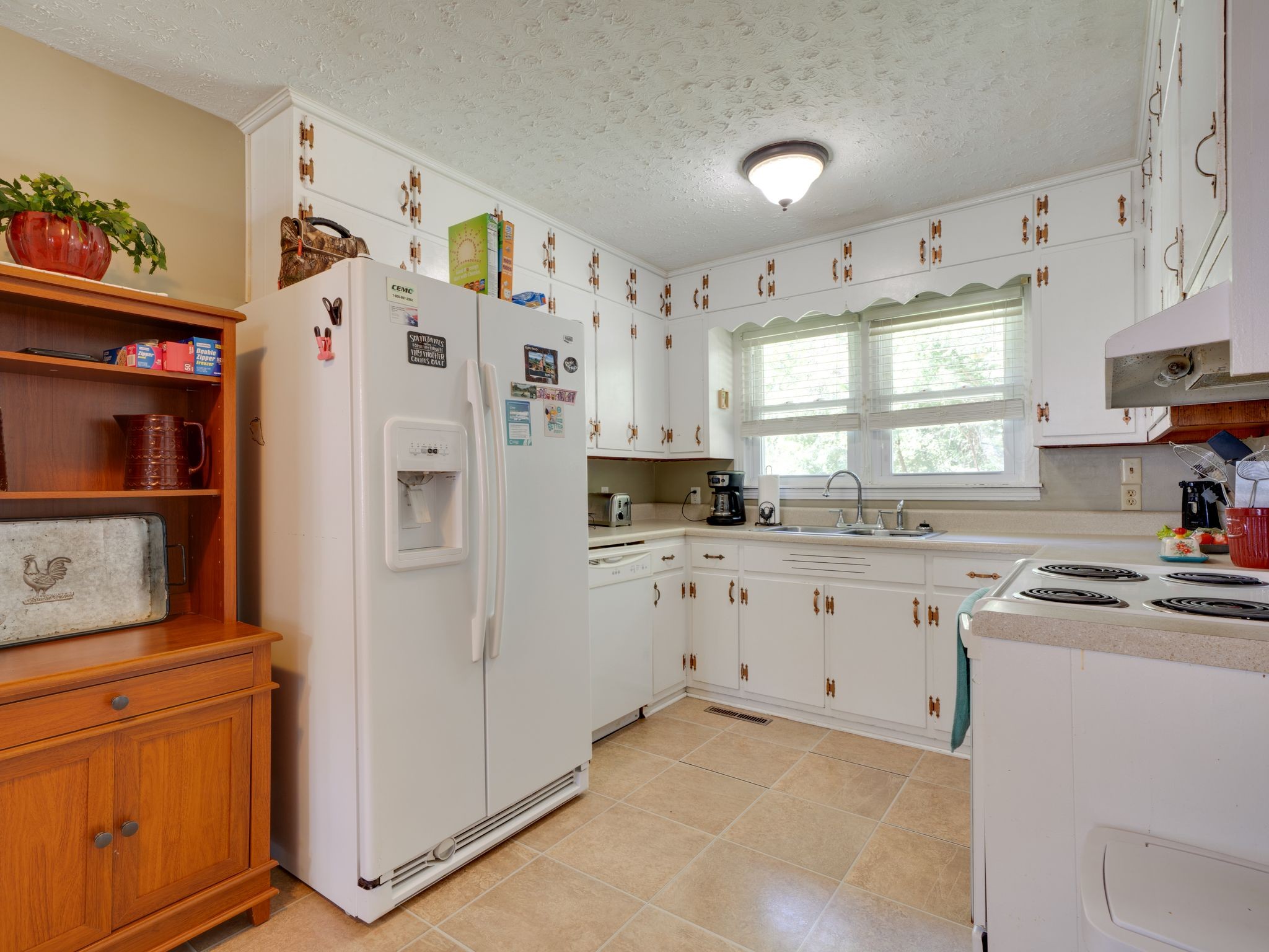125 The Trace Dover, TN 37058 - Photo 10 of 29 a kitchen with stainless steel appliances cabinets and a window