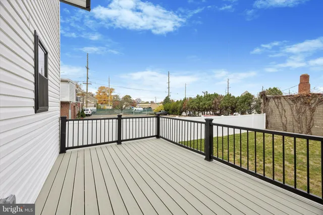 a view of a balcony with wooden floor