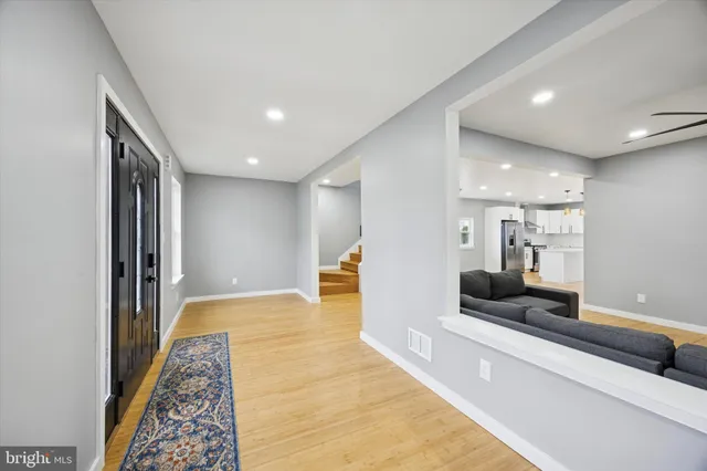 a view of a hallway with a couch and a coffee table