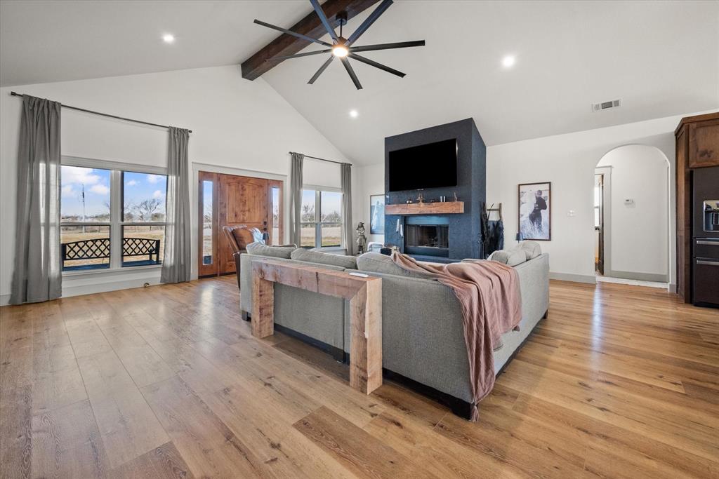 618 Minnis Road Collinsville, TX 76233 - Photo 12 of 37 a living room with furniture fireplace and flat screen tv