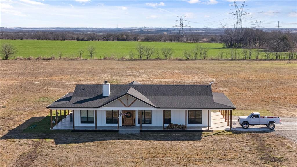 618 Minnis Road Collinsville, TX 76233 - Photo 2 of 37 an aerial view of a house with a yard