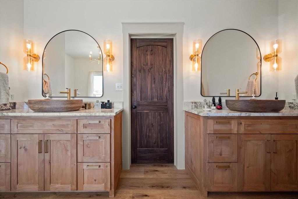 618 Minnis Road Collinsville, TX 76233 - Photo 26 of 37 a bathroom with a double vanity sink and a mirror