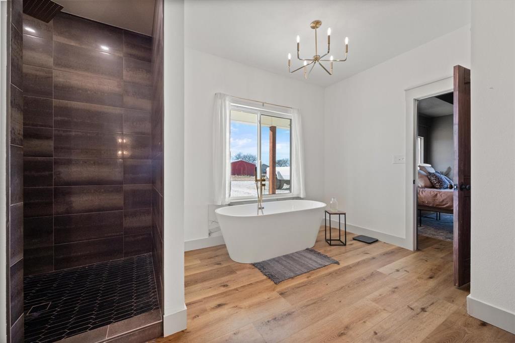 618 Minnis Road Collinsville, TX 76233 - Photo 27 of 37 a living room with a furniture and a chandelier