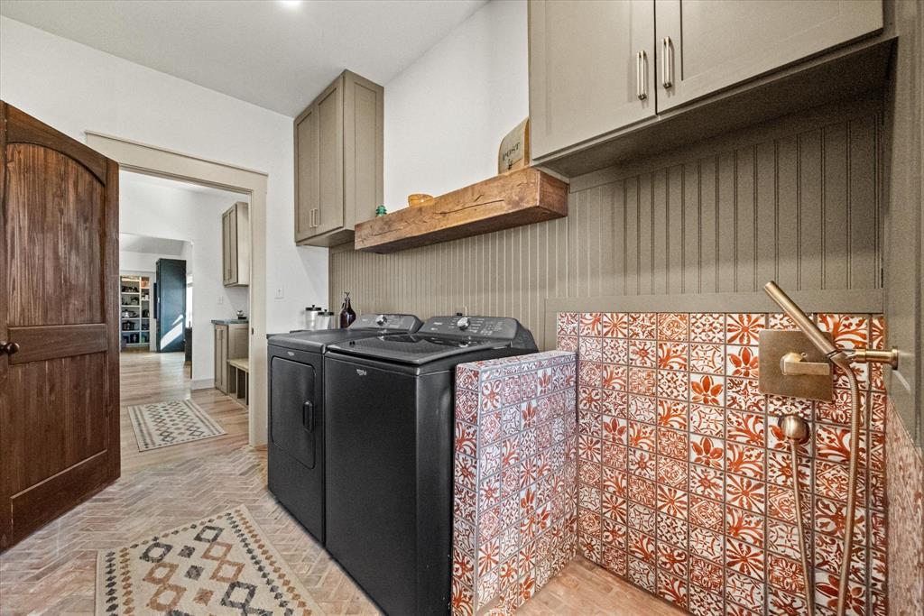 618 Minnis Road Collinsville, TX 76233 - Photo 36 of 37 a kitchen with stainless steel appliances granite countertop a refrigerator a stove and a sink with wooden cabinets