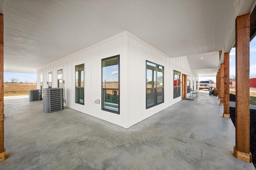618 Minnis Road Collinsville, TX 76233 - Photo 8 of 37 a view of a big room with windows and entryway