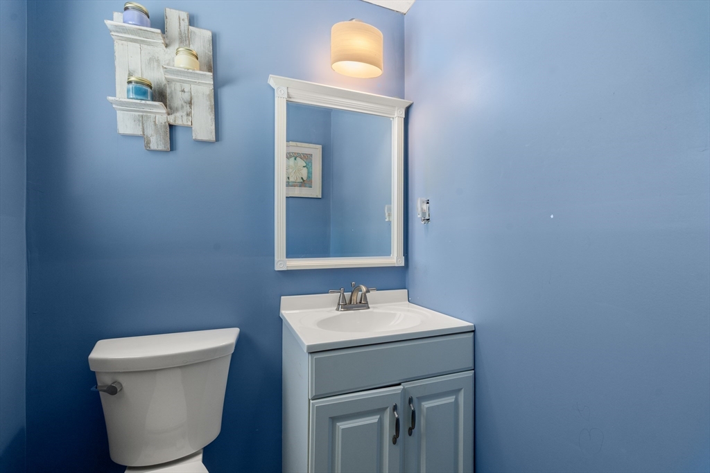 7 Van Beal Road Randolph, MA 02368 - Photo 15 of 35 a bathroom with a toilet sink and mirror