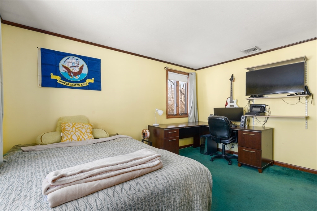 7 Van Beal Road Randolph, MA 02368 - Photo 17 of 35 a bedroom with a bed and a flat screen tv