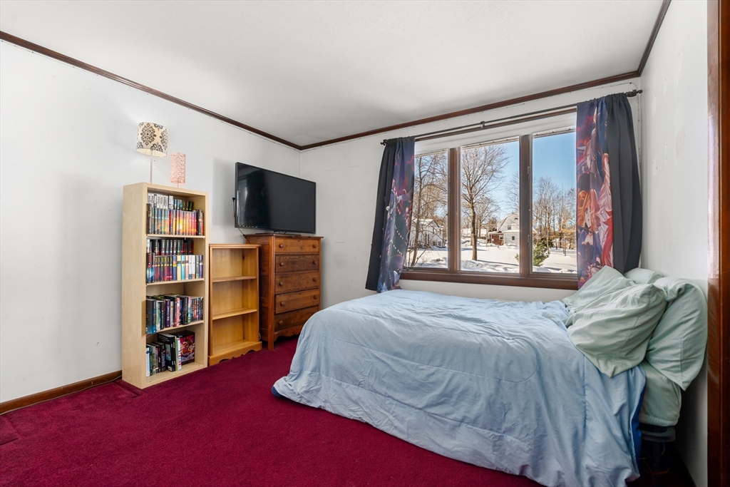 7 Van Beal Road Randolph, MA 02368 - Photo 18 of 35 a bedroom with a bed furniture and a flat screen tv
