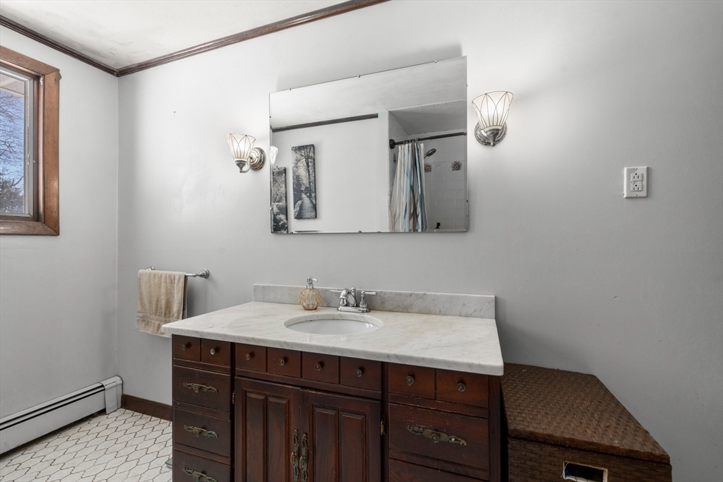 7 Van Beal Road Randolph, MA 02368 - Photo 20 of 35 a bathroom with a sink and a mirror
