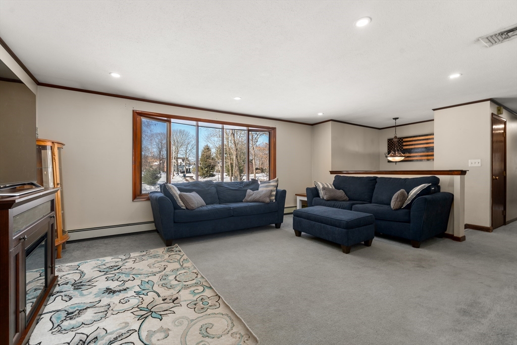 7 Van Beal Road Randolph, MA 02368 - Photo 2 of 35 a living room with furniture and a rug