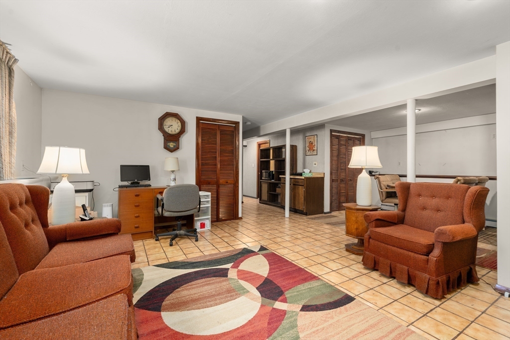 7 Van Beal Road Randolph, MA 02368 - Photo 25 of 35 a living room with furniture and wooden floor