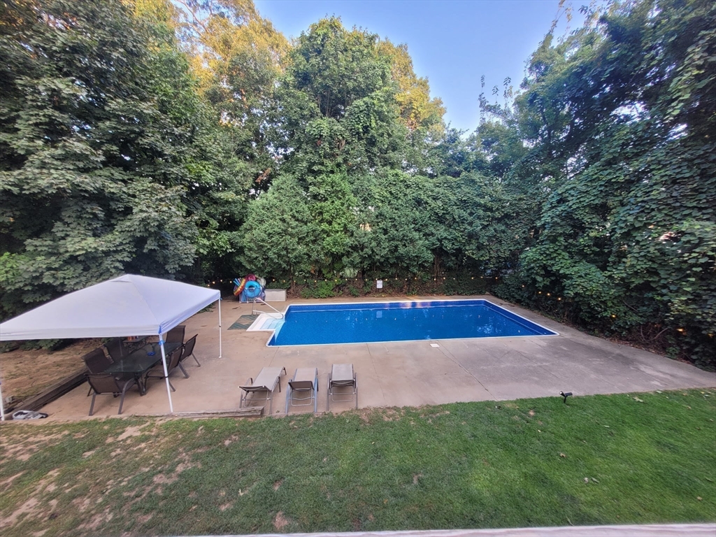 7 Van Beal Road Randolph, MA 02368 - Photo 31 of 35 a backyard of a house with table and chairs