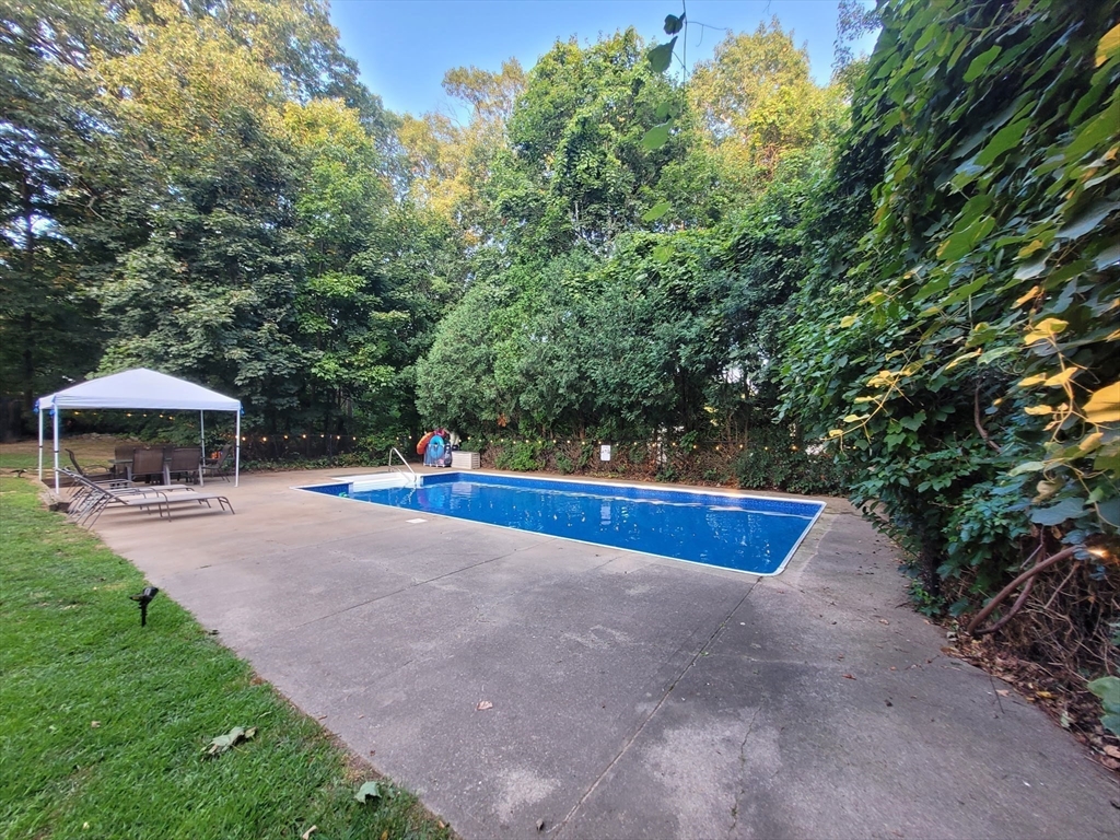 7 Van Beal Road Randolph, MA 02368 - Photo 32 of 35 a view of a swimming pool with an outdoor space and seating area