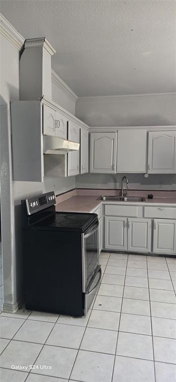 609 Elwayne Avenue Dallas, TX 75217 - Photo 3 of 9 Kitchen featuring white cabinetry with decorative molding, a black electric range, a stainless steel sink with a gooseneck faucet, light-toned countertops, and white tile flooring
