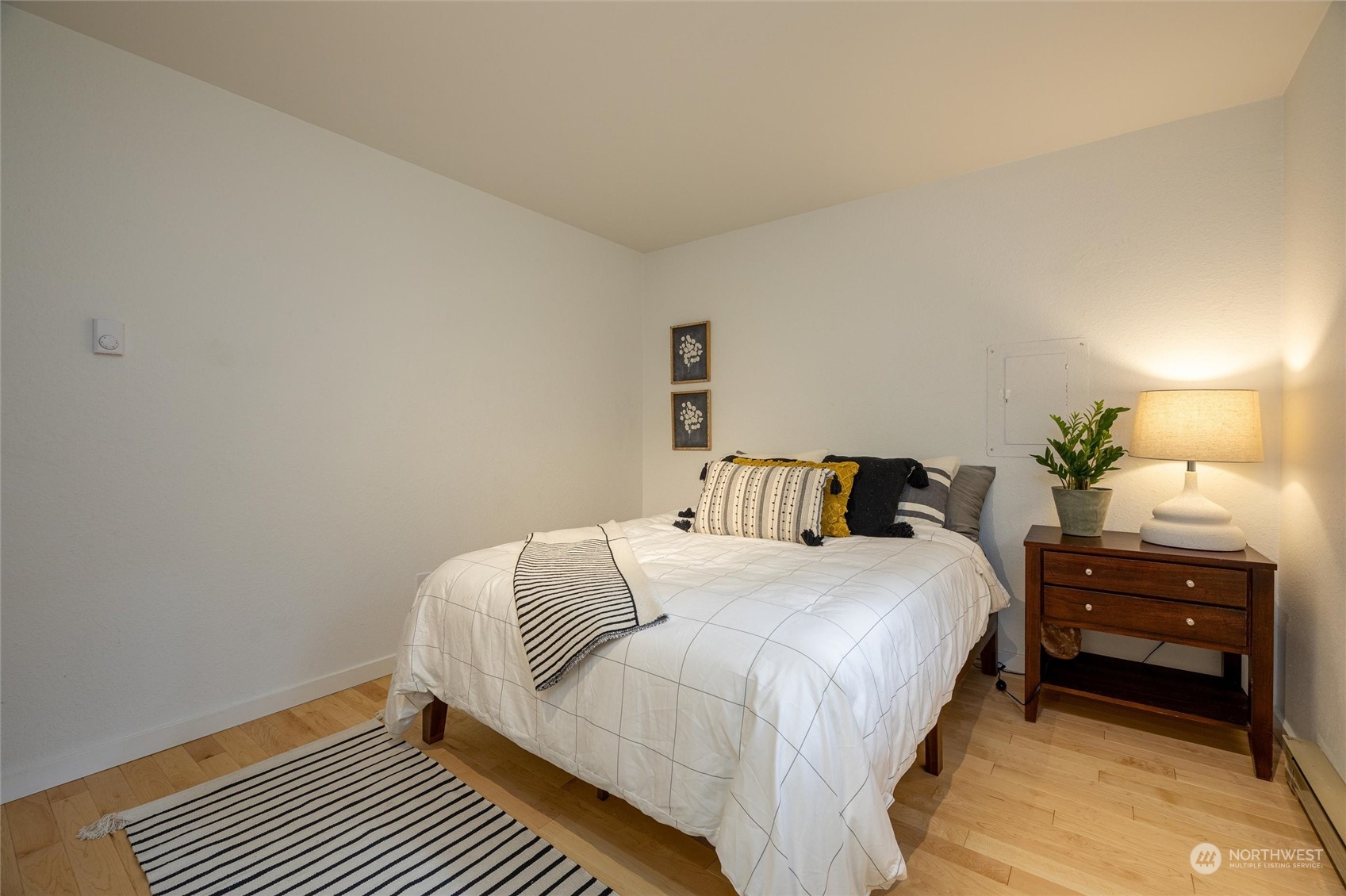 32-34 Maple Court Bellingham, WA 98229 - Photo 25 of 31 a bedroom with a bed and a lamp on dresser