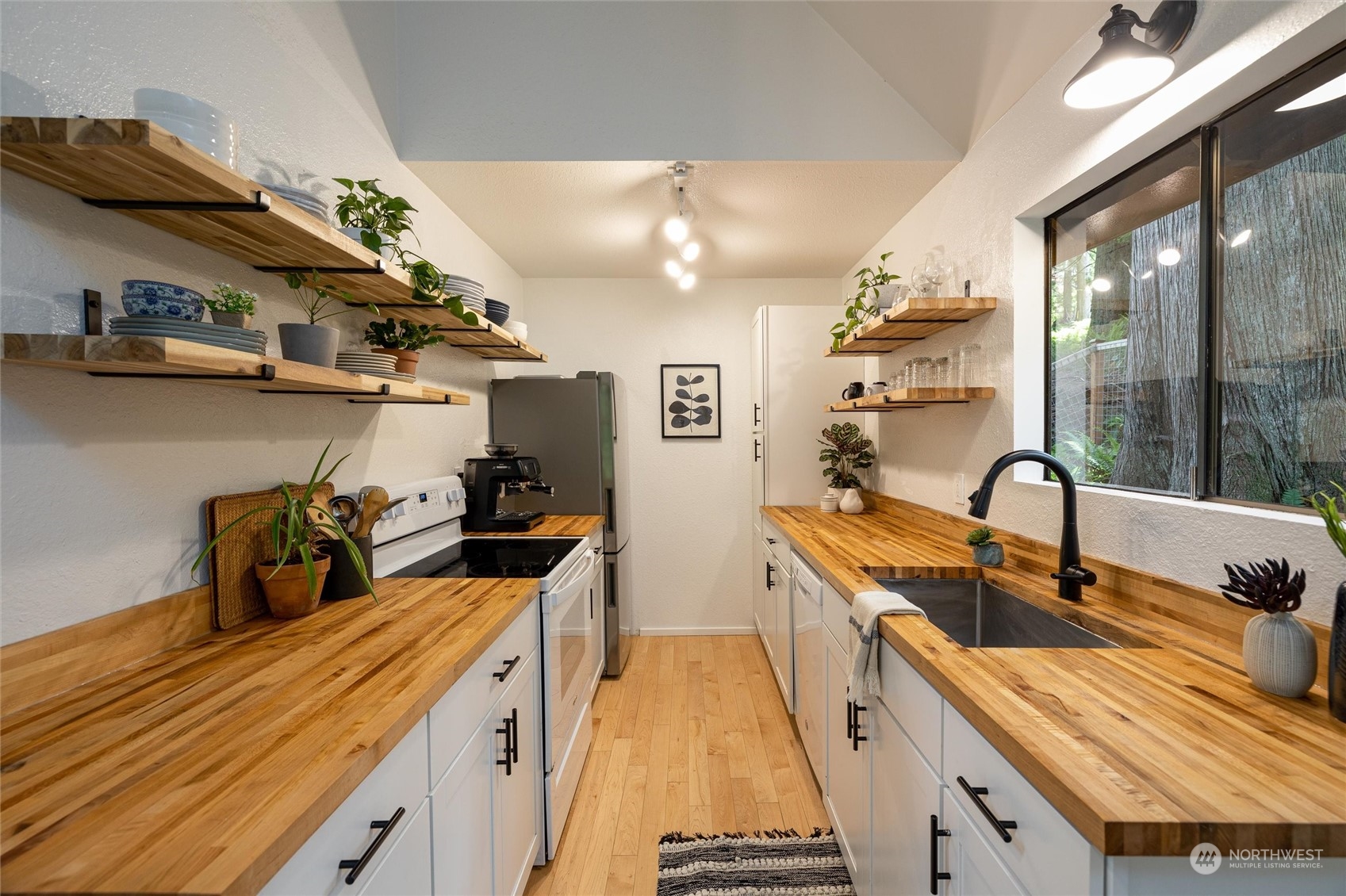 32-34 Maple Court Bellingham, WA 98229 - Photo 10 of 31 a kitchen with stainless steel appliances granite countertop a sink and a stove