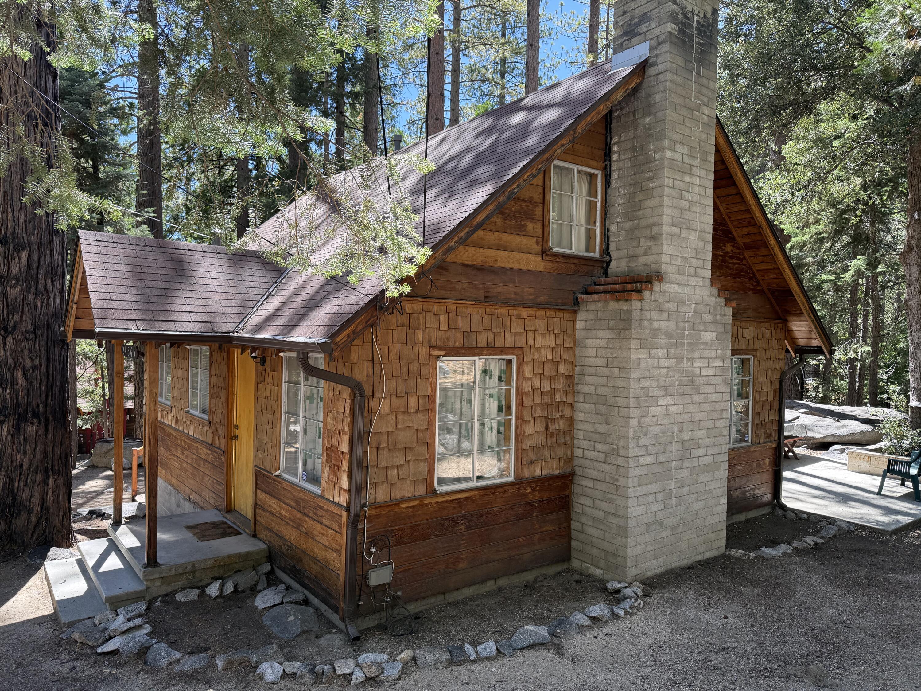 24565 Fern Valley Road Idyllwild, CA 92549 - Photo 4 of 17 a front view of a house with a yard