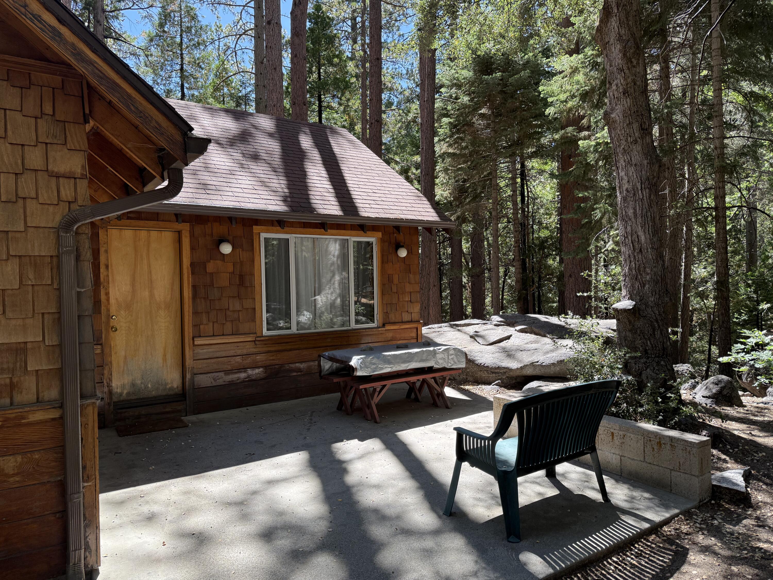 24565 Fern Valley Road Idyllwild, CA 92549 - Photo 5 of 17 a view of house with backyard outdoor seating and trees