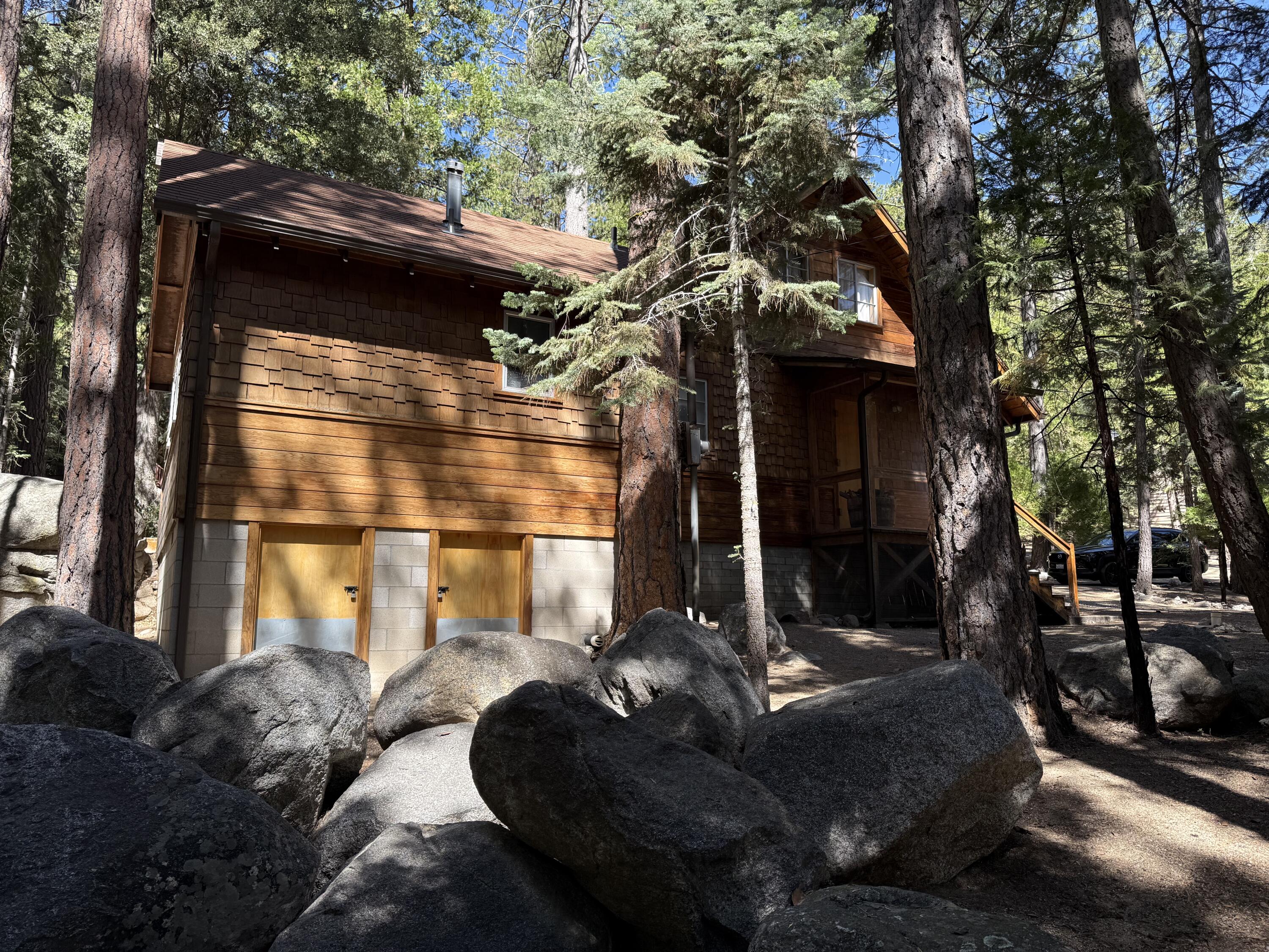 24565 Fern Valley Road Idyllwild, CA 92549 - Photo 9 of 17 a front view of a house with a yard