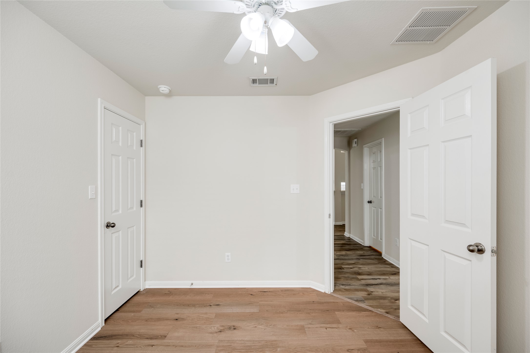 1813 Nelson Ranch Loop Cedar Park, TX 78613 - Photo 29 of 39 Hardwood-style flooring extends through this room, with a classic ceiling fan providing airflow.