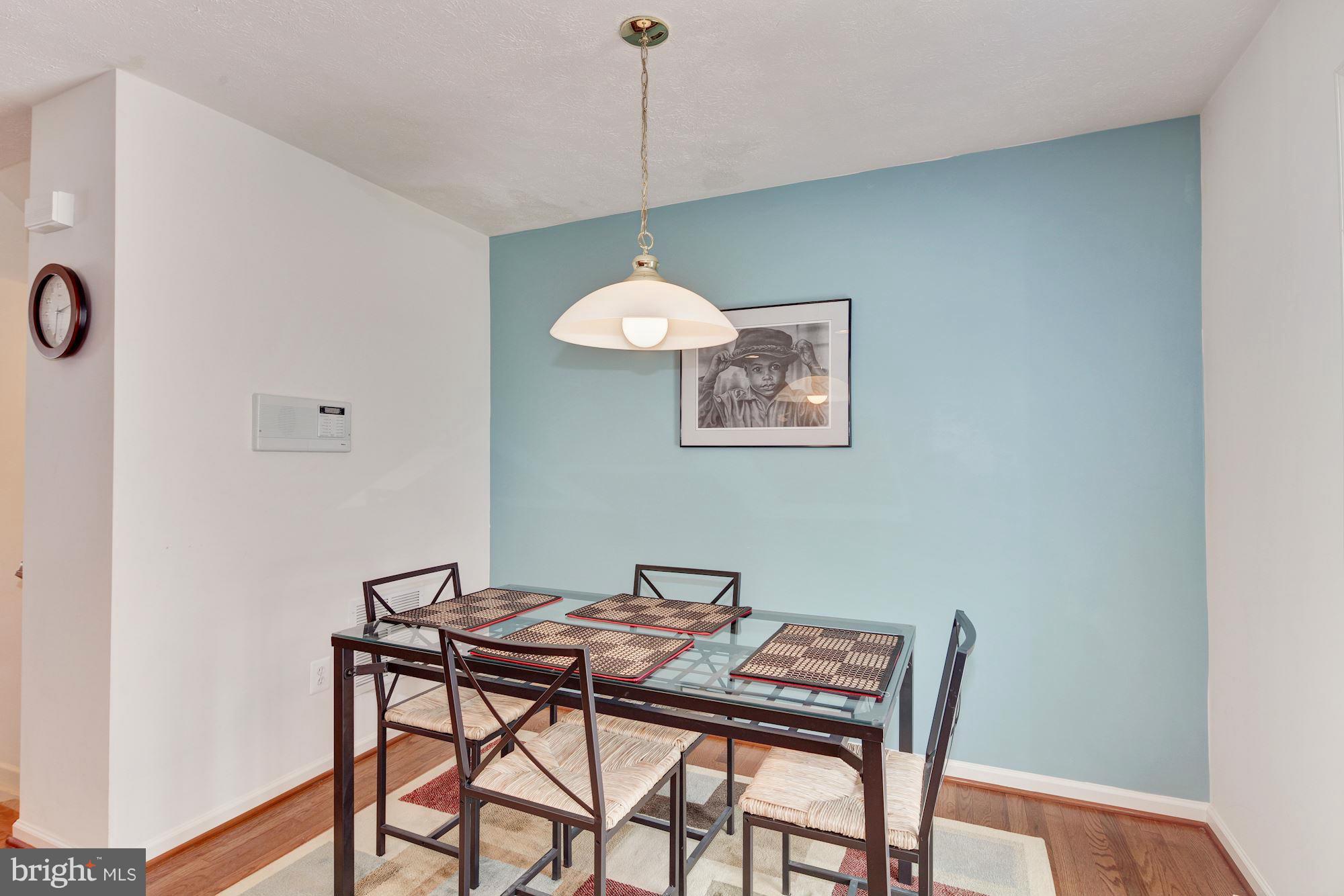 9851 Decatur Road Baltimore, MD 21220 - Photo 14 of 24 a view of a dining room with a table and chairs