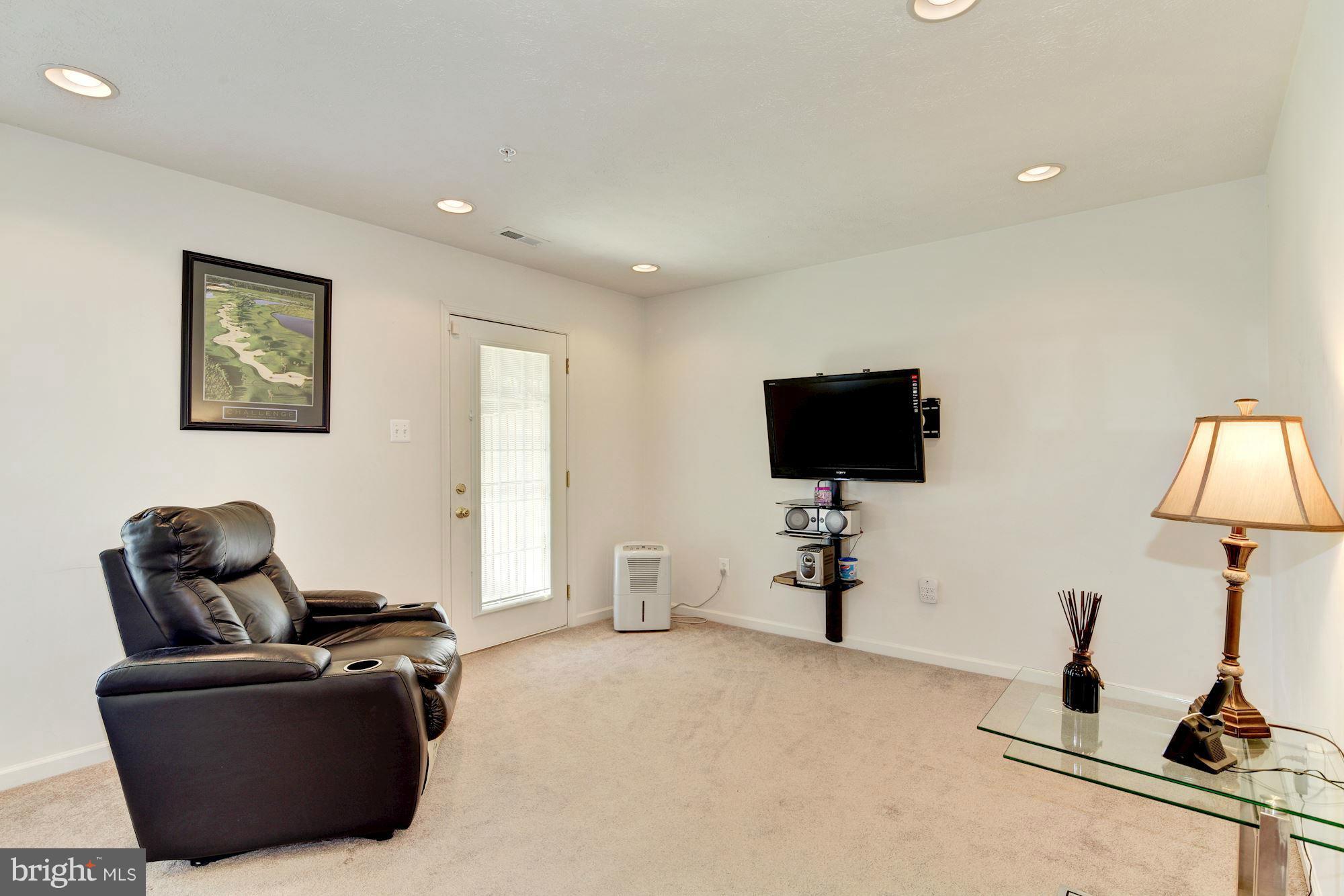 9851 Decatur Road Baltimore, MD 21220 - Photo 3 of 24 a living room with furniture and a flat screen tv