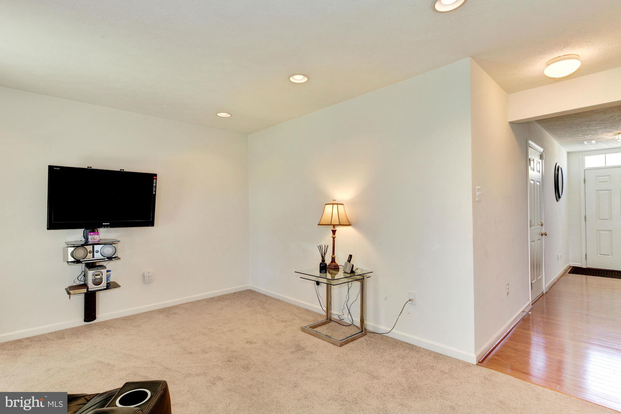 9851 Decatur Road Baltimore, MD 21220 - Photo 4 of 24 a living room with furniture and a flat screen tv