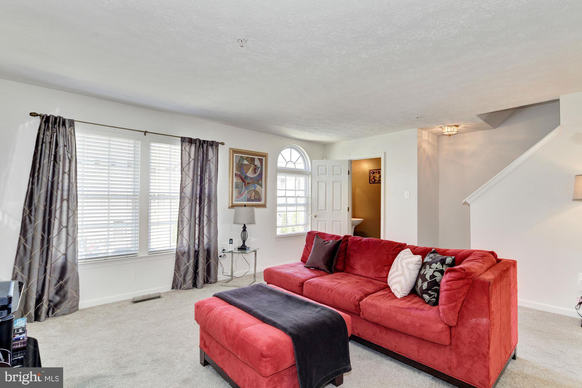 9851 Decatur Road Baltimore, MD 21220 - Photo 7 of 24 a living room with furniture and a window