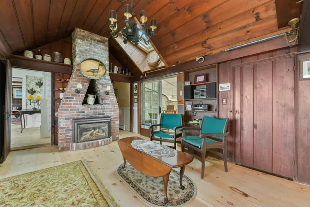 a view of a porch with furniture and a gate