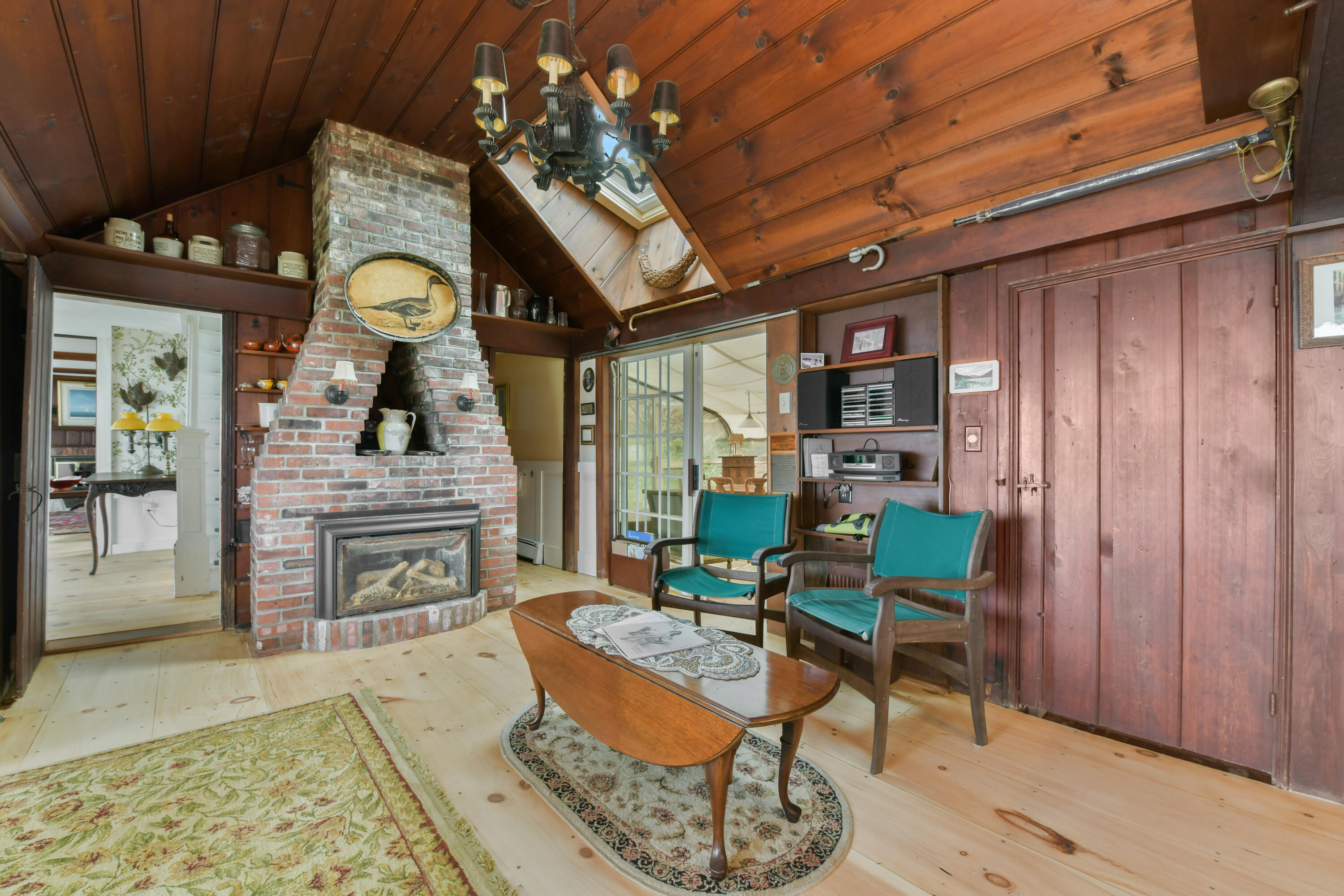 645 South Orleans Road Orleans, MA 02653 - Photo 14 of 57 a living room with furniture a fireplace and a flat screen tv