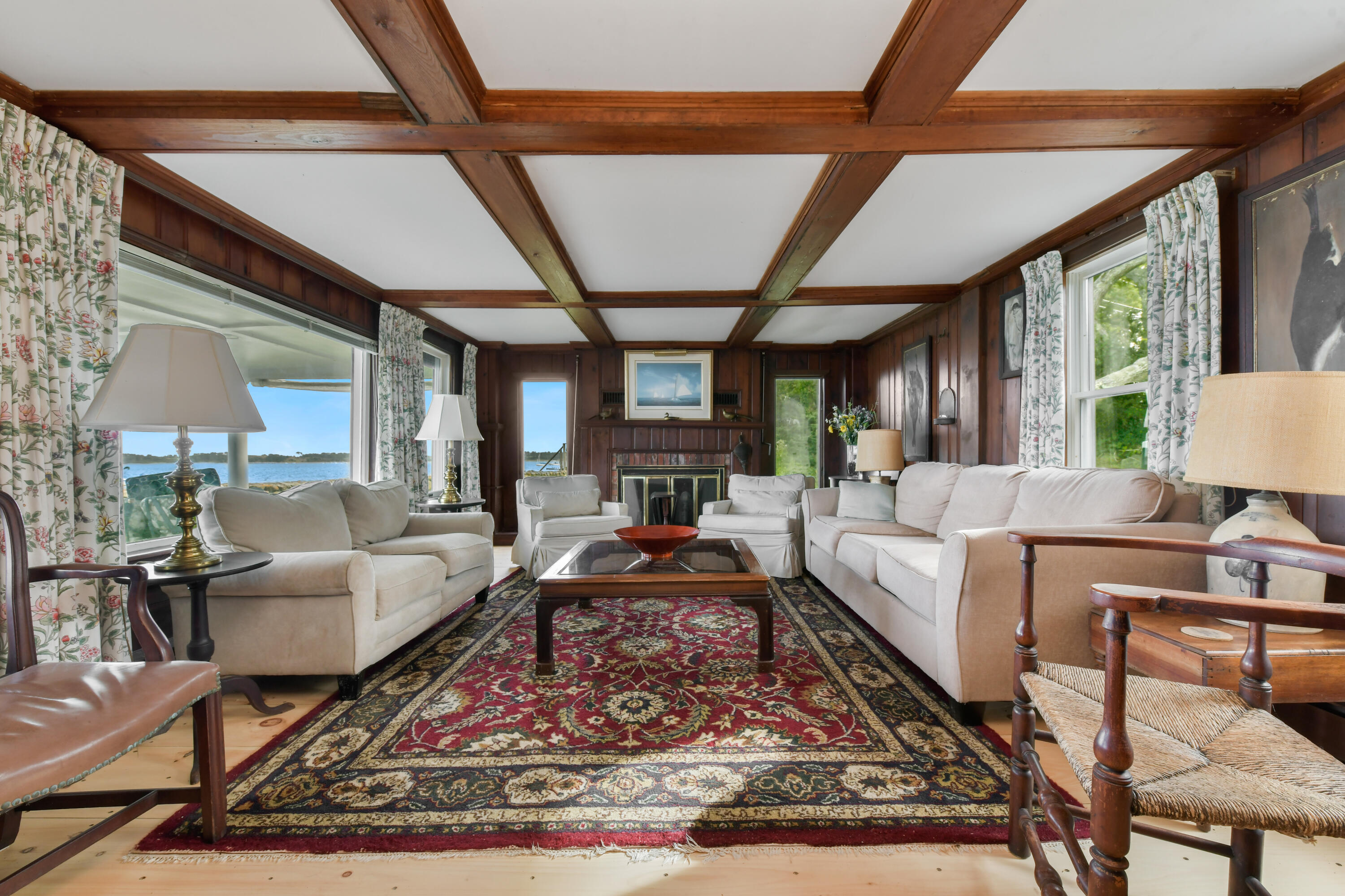 645 South Orleans Road Orleans, MA 02653 - Photo 19 of 57 a living room with furniture a rug a table and a large window