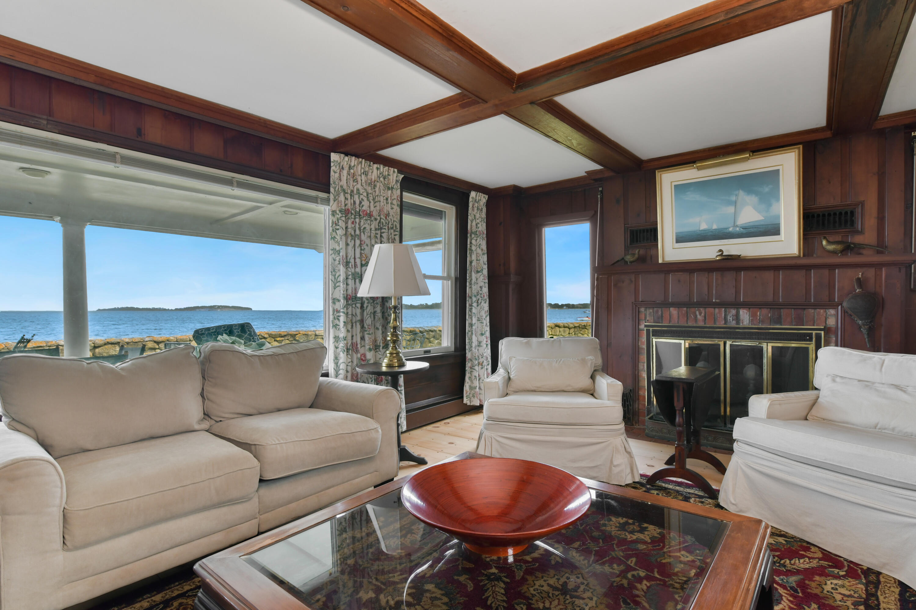 645 South Orleans Road Orleans, MA 02653 - Photo 20 of 57 a living room with furniture a fireplace and a large window