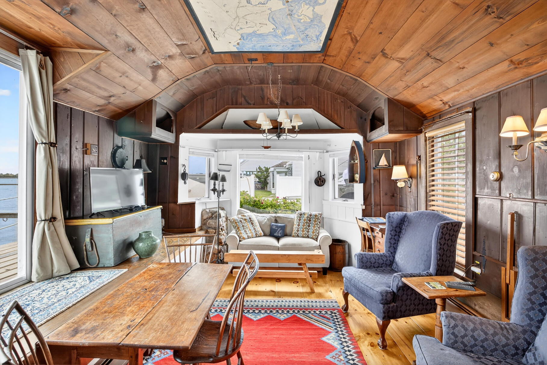 645 South Orleans Road Orleans, MA 02653 - Photo 36 of 57 a living room with furniture a fireplace and a counter top space