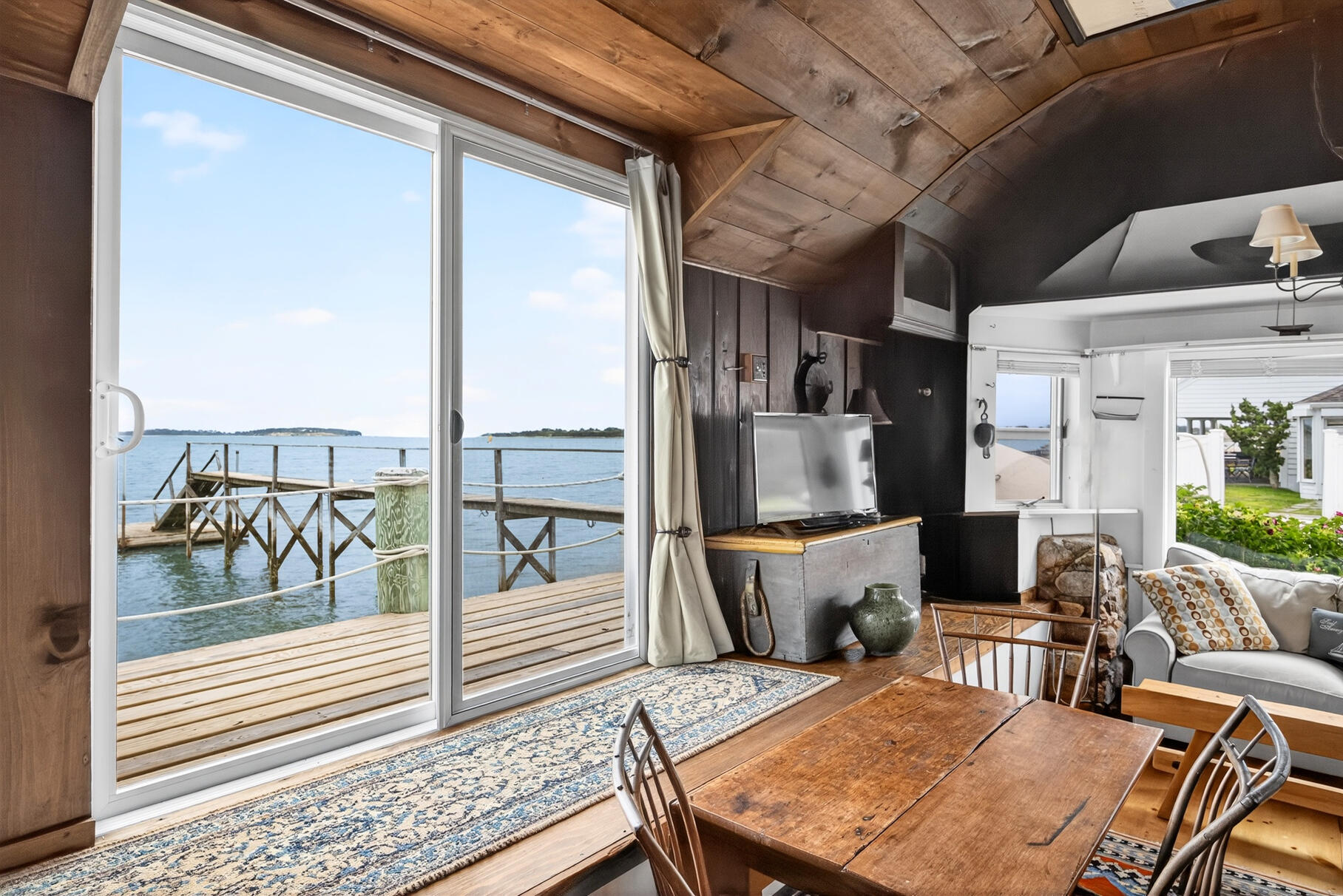 645 South Orleans Road Orleans, MA 02653 - Photo 37 of 57 a living room with furniture and a fireplace