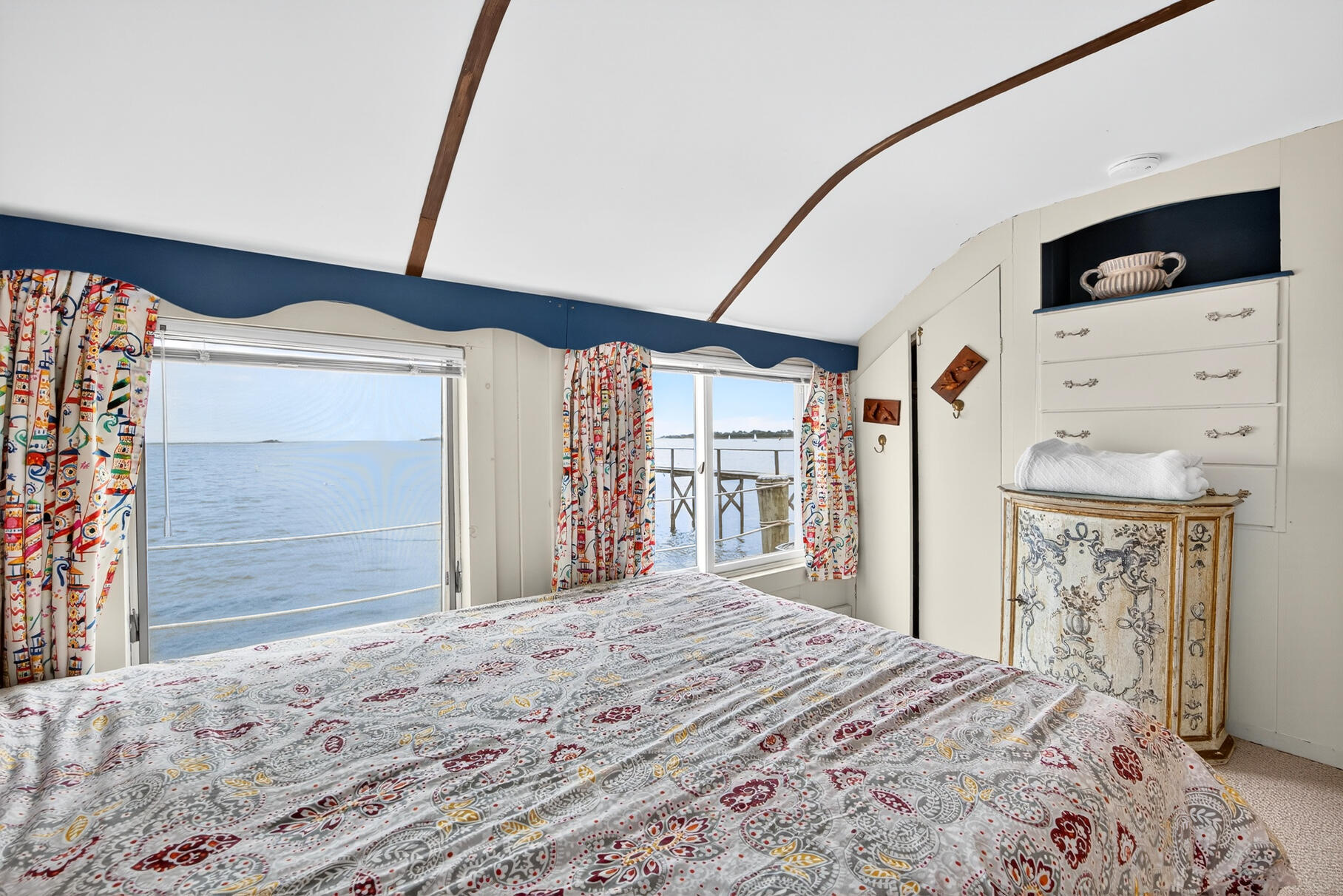 645 South Orleans Road Orleans, MA 02653 - Photo 39 of 57 a bedroom with a bed and a large window