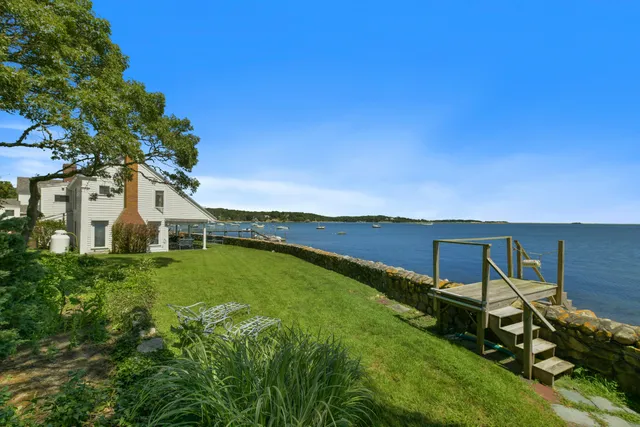 a aerial view of a house with a ocean view